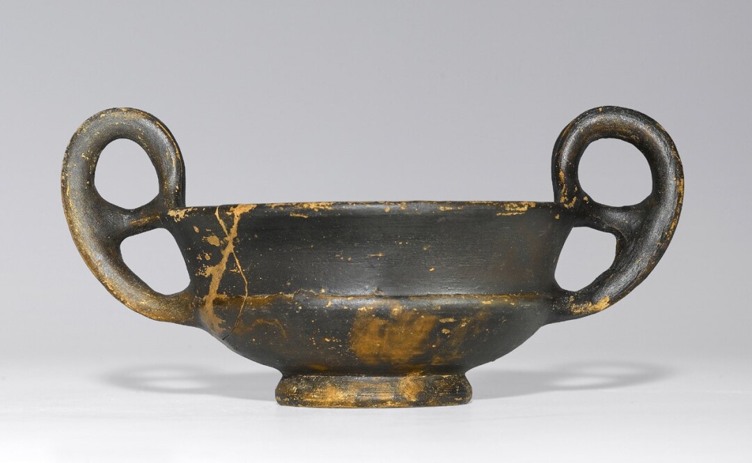 Cup with two open-work handles