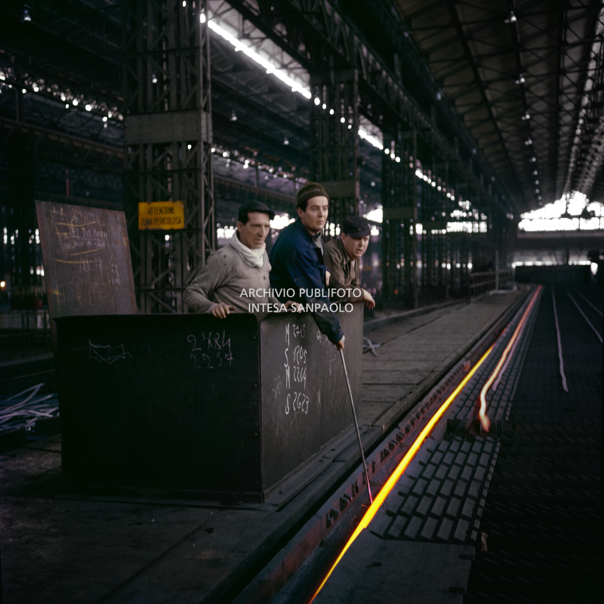 Workers in the Finsider iron and steel plant