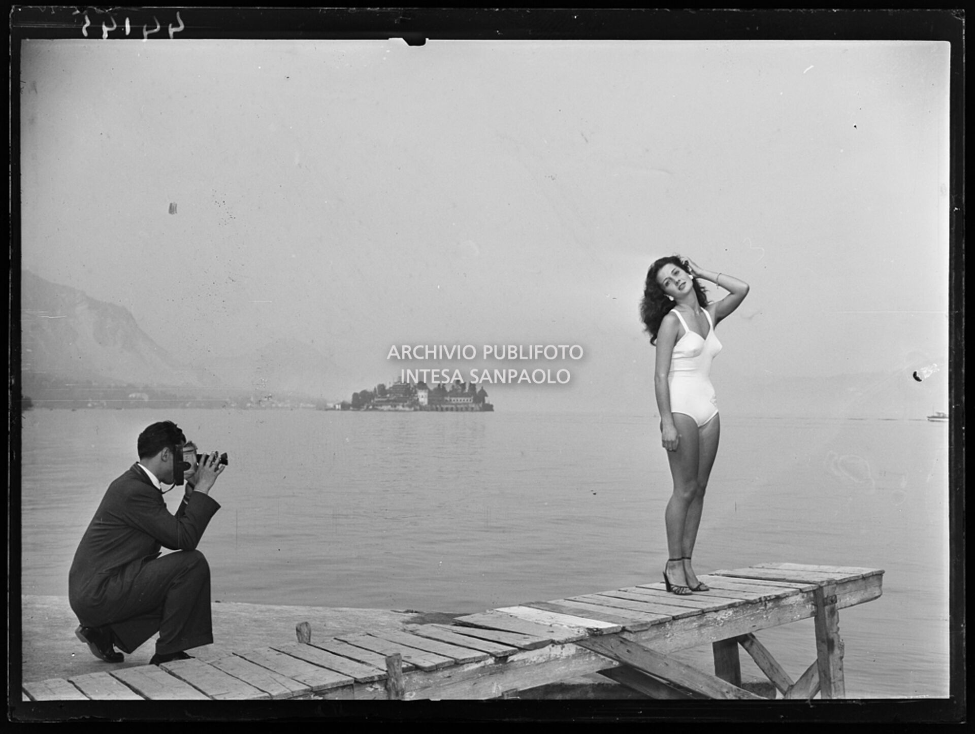 Ornella Zamperetti, second place in Miss Italia contest, poses in a swimsuit for a photographer in Stresa