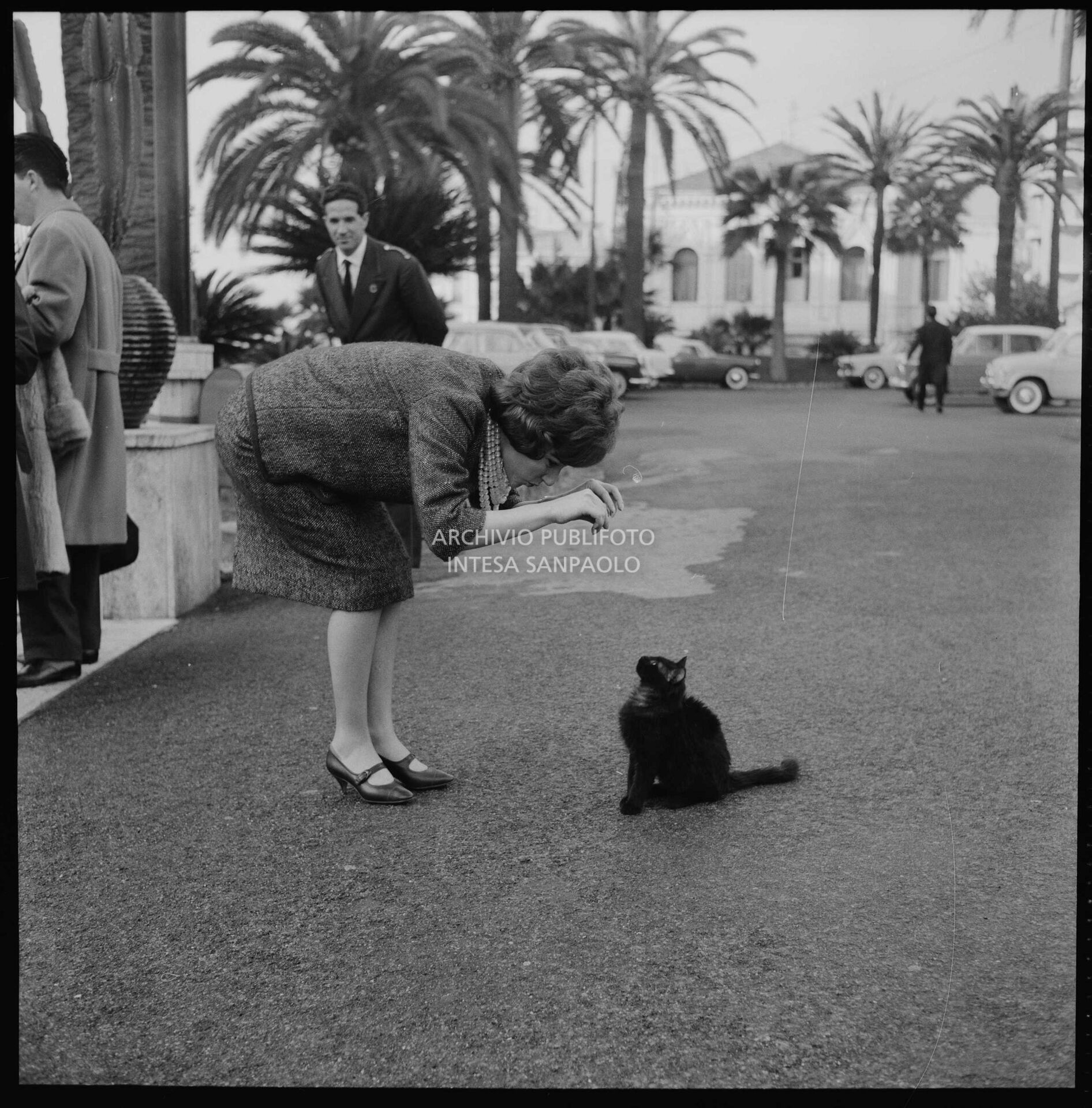 Jolanda Rossin plays with a cat in Sanremo during the 11th Festival