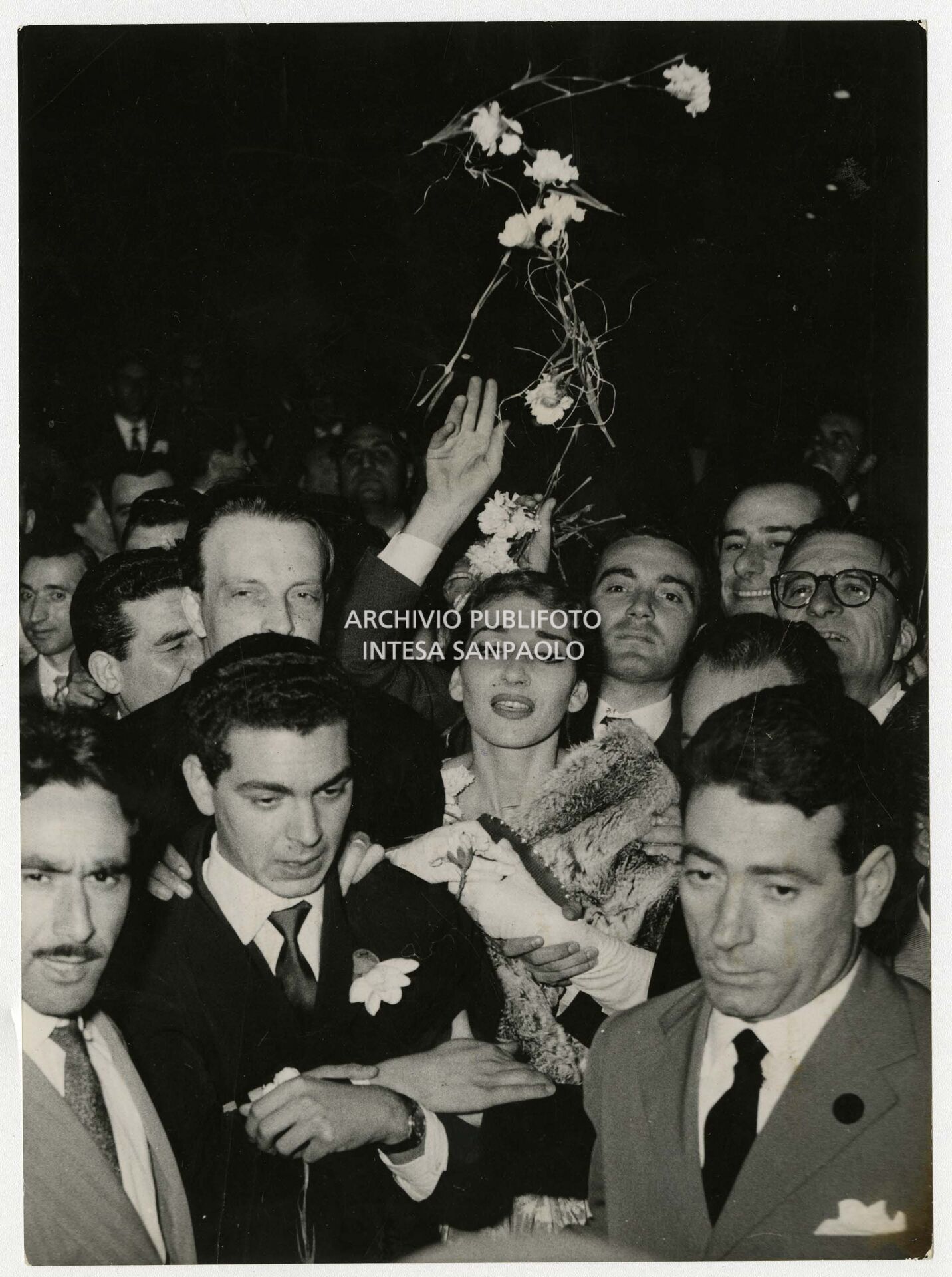 Maria Callas surrounded by admirers at the end of her "last" appearance at La Scala, where she performed Vincenzo Bellini's Il Pirata.
