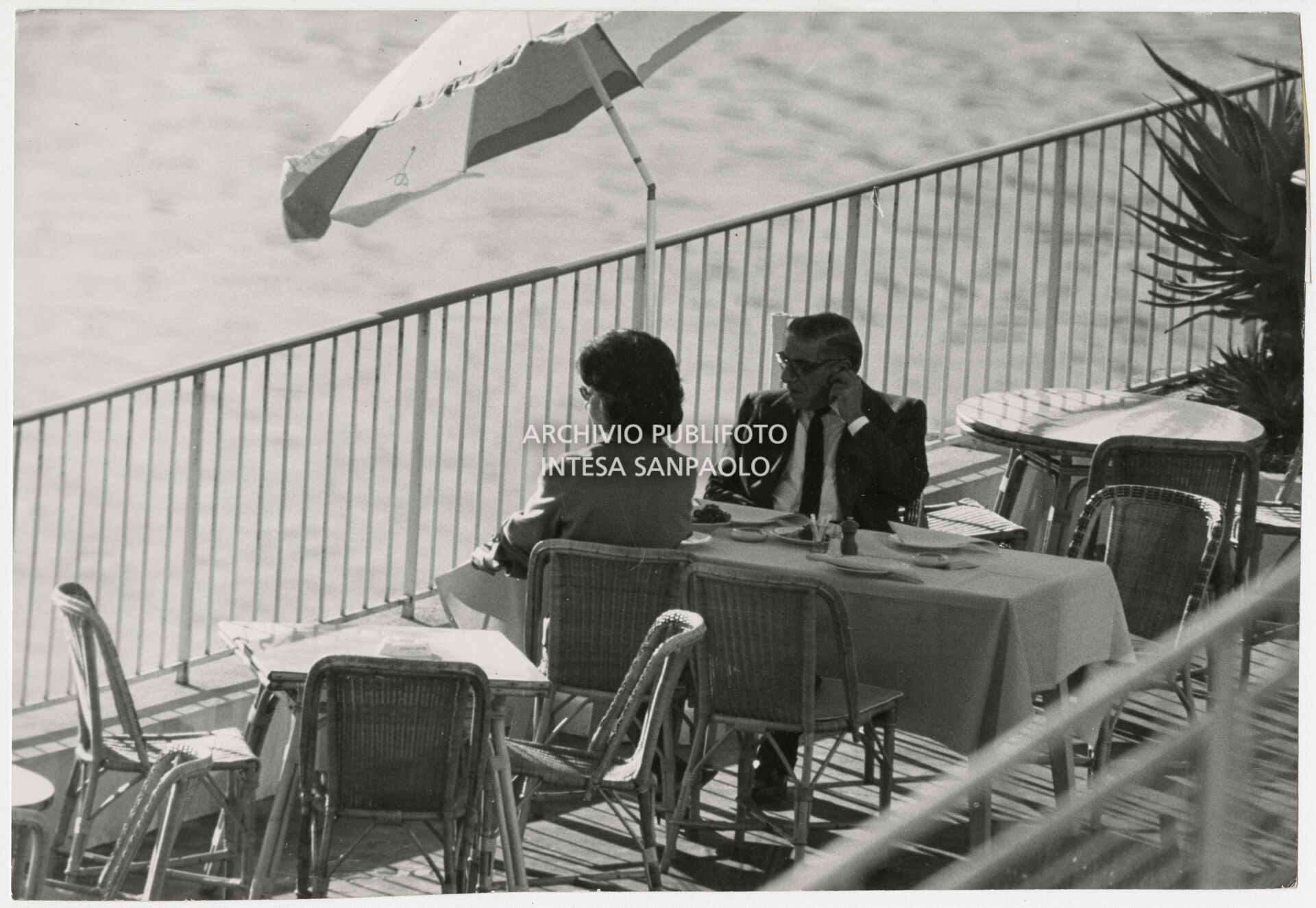 Maria Callas and Aristotele Onassis on the terrace of the indoor pool at the Casino