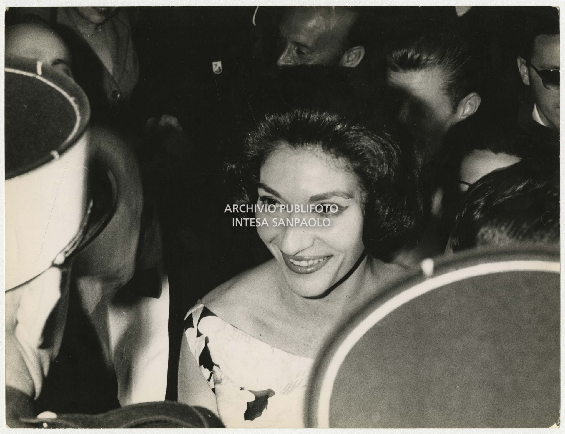 Maria Callas surrounded by the crowd at the Cannes Film Festival