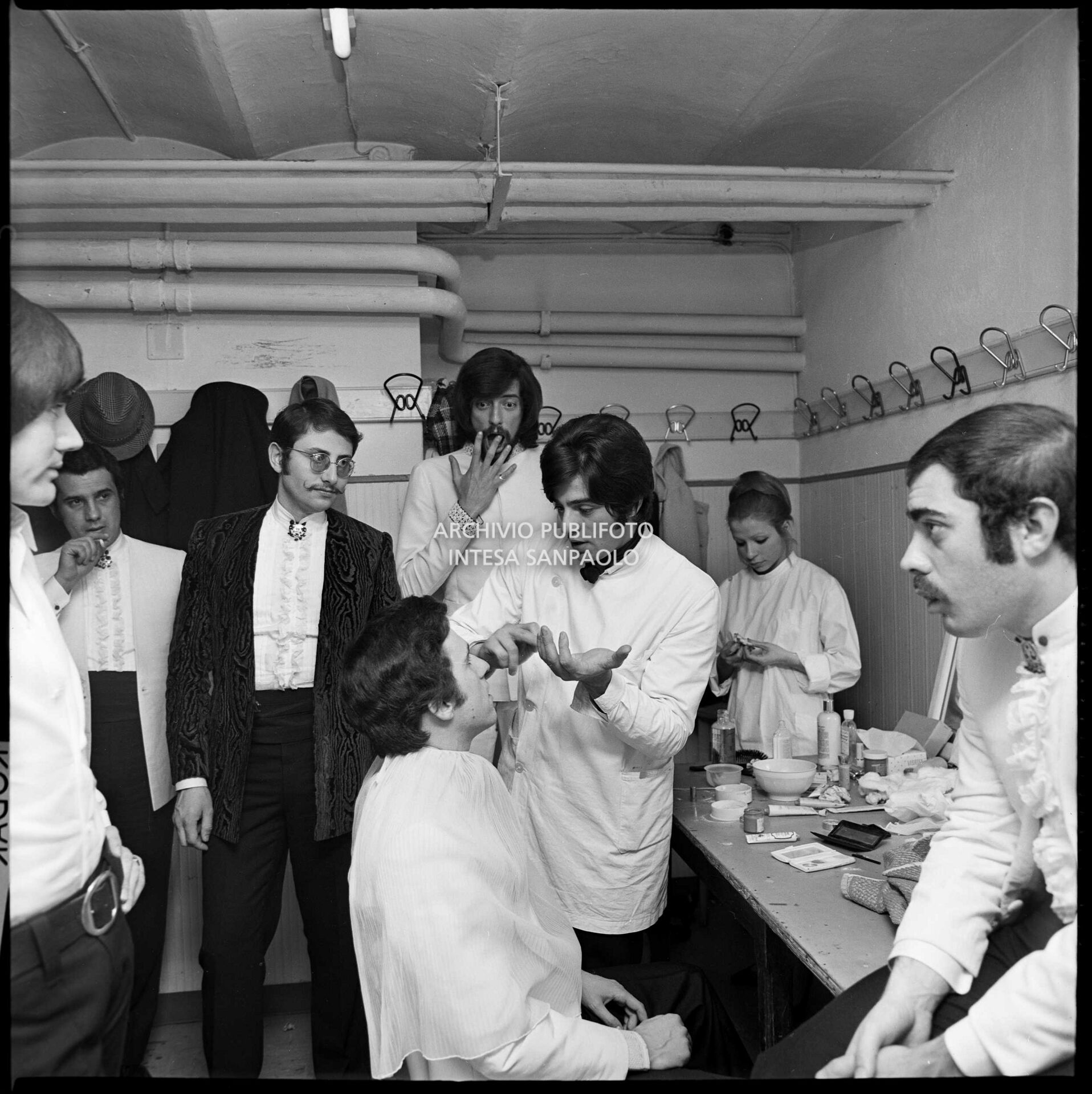 Mal (left) and some members of Dik-Dik and The Rokes in the make-up room at the 19th Sanremo Festival