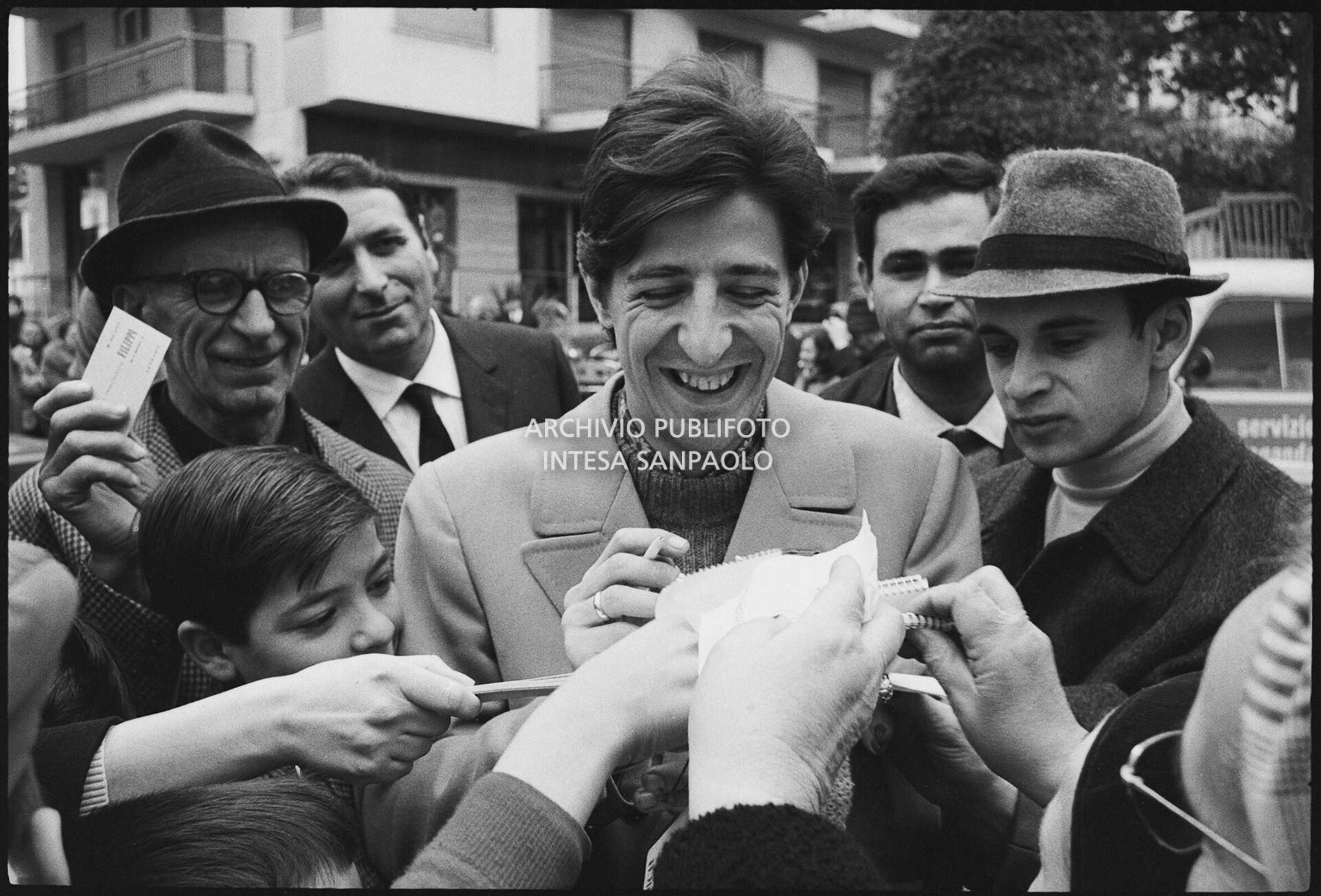 Giorgio Gaber signs autographs during the 17th Sanremo Festival, 1967
