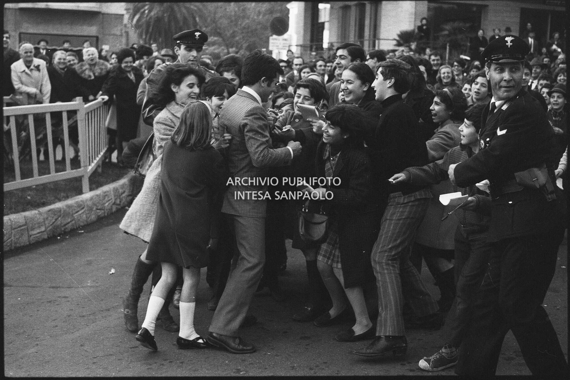 Al Bano surrounded by fans outside the Casino during the 18th Sanremo Festival